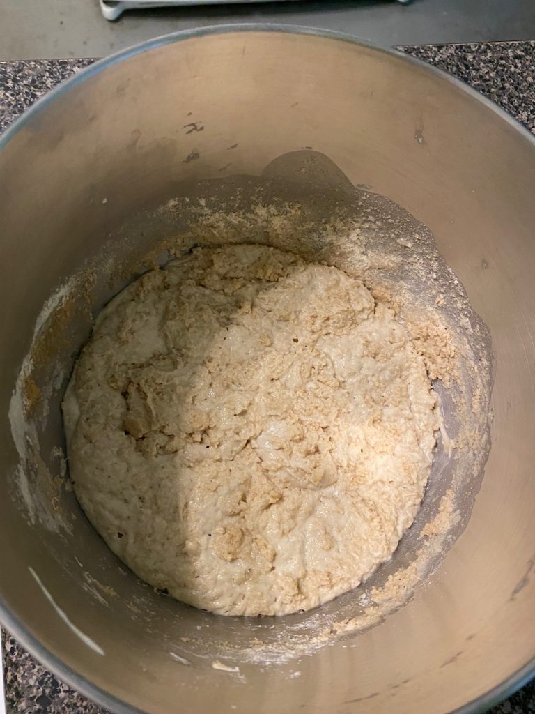 A levain sitting in the mixing bowl waiting to get turned into bread dough