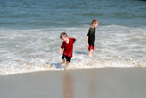 Brian running away from a wave